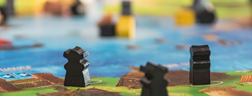 Games by Christopher Paul High on Unsplash: Make Your Move by Laura Heffernan (The Modest Reader)