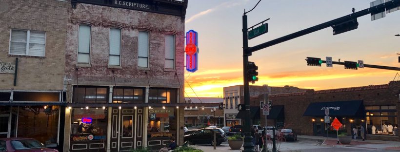 Photo of a small town intersection at sunset
